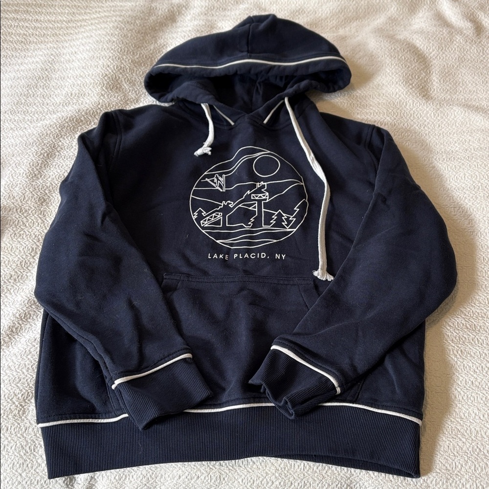 Lake Placid navy blue hoodie with white piping.